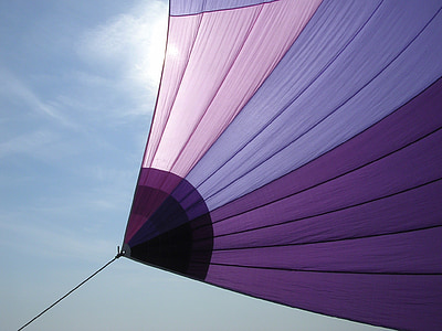 purple, pink, and lavender textile under blue sky