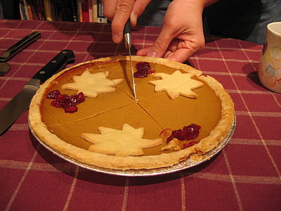 person holding knife sliced pie