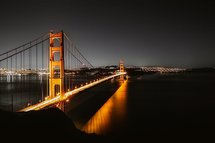 time lapse photography of golden gate during night