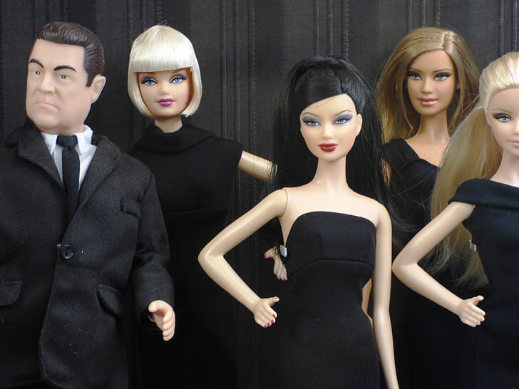 four female and one male toy dolls