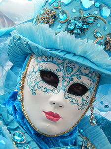 person wearing white and blue face mask