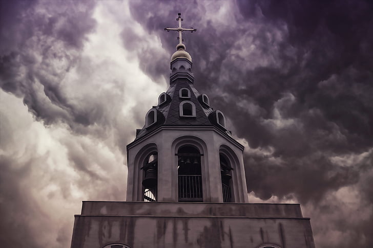 landscape photography of church under cloudy sky