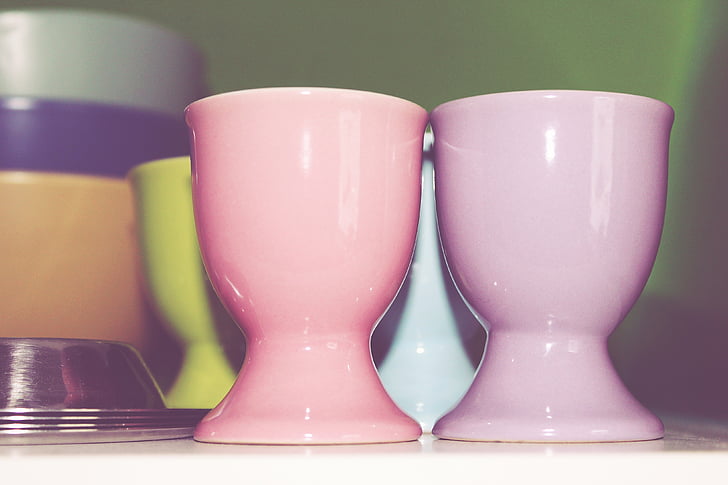 closeup photo of two pink ceramic cups
