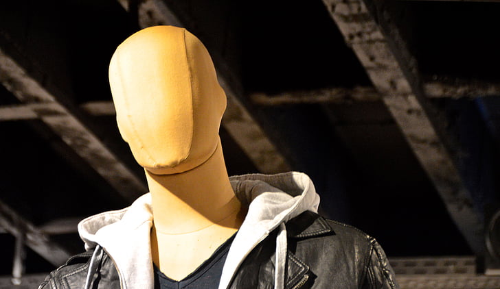 brown mannequin with black leather jacket