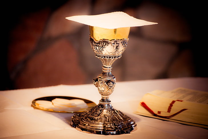 silver goblet on top of white surface