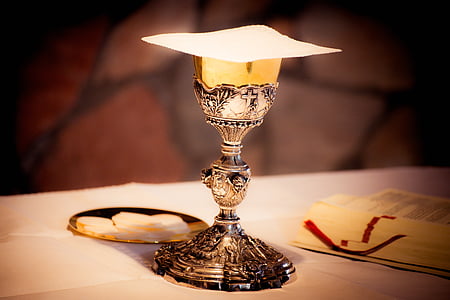 silver goblet on top of white surface
