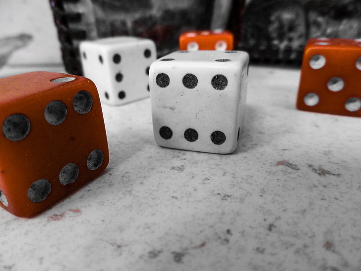 red and white dices on top of white surface