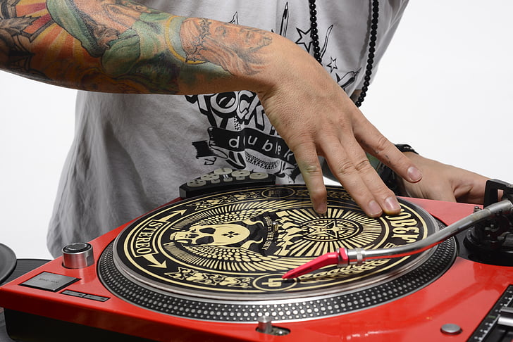 person spinning turntable
