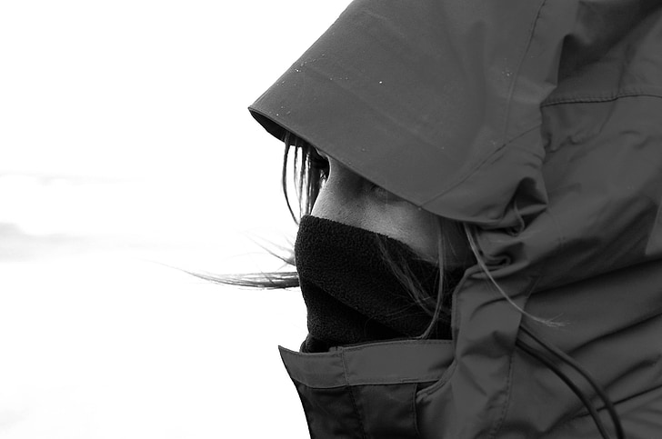 woman in hoodie and balaclava greyscale photography
