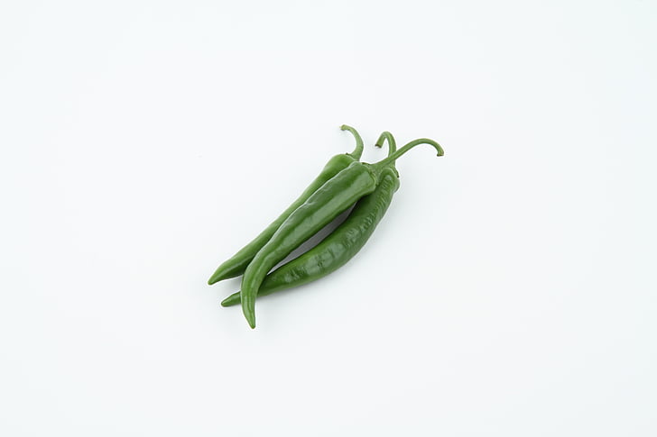 three green chili peppers