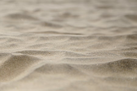 macro photography of gray sand