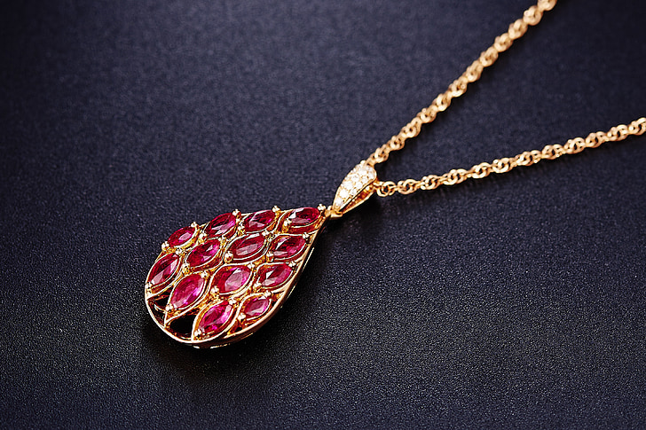 red jeweled gold-colored pendant necklace