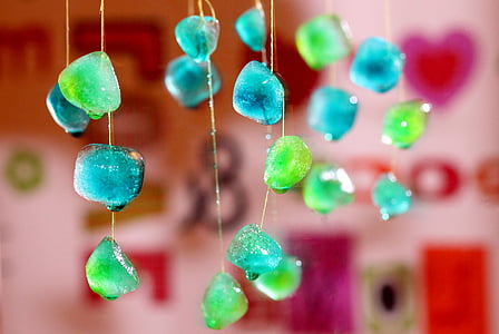 shallow focus photography of blue and green gemstone hanging decors