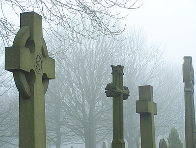cemetery cross in mist
