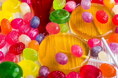 assorted-color candy lot on white surface