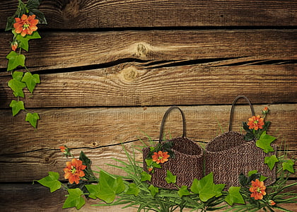 two brown woven baskets and orange flowers