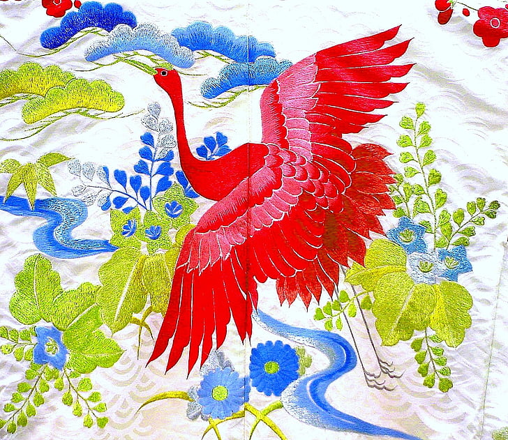 red bird with blue and green flower textile