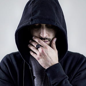 man wearing black hoodie