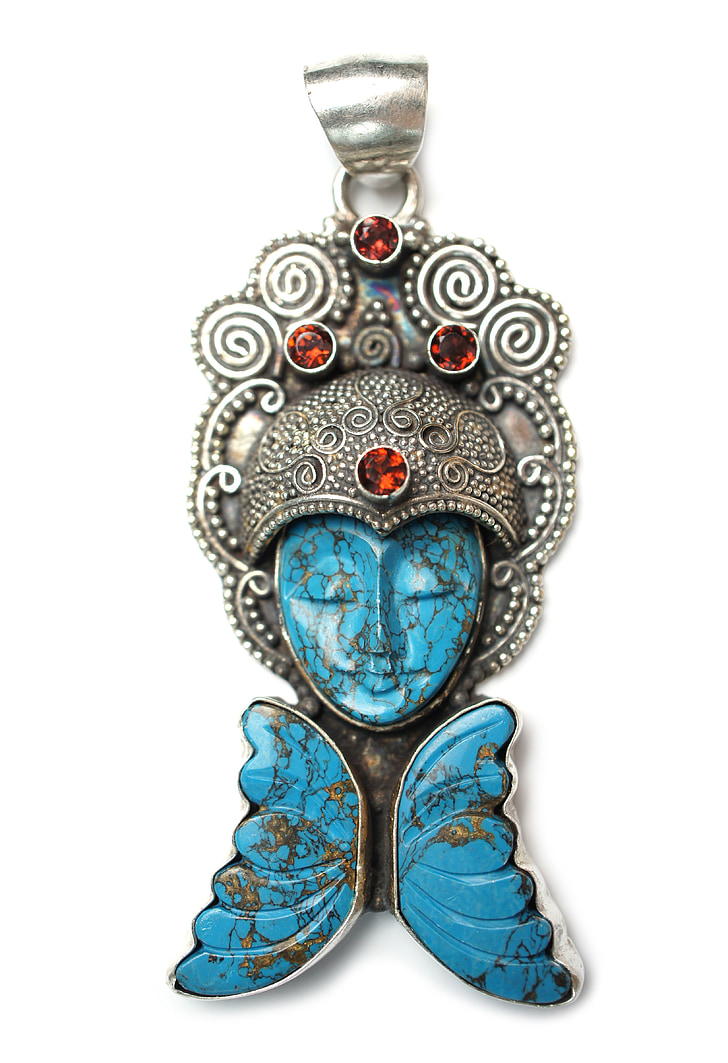 silver-colored blue stone face pendant