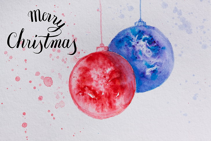 red and blue bauble with merry christmas text overlay