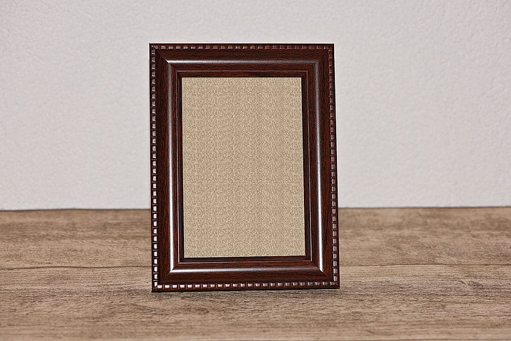 brown photo frame on brown surface