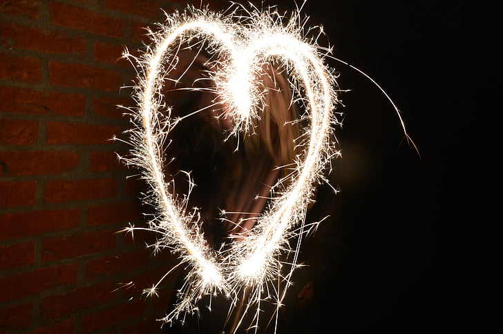 yellow sparks forming heart
