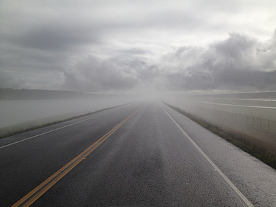 gray empty asphalt road covered with fogs