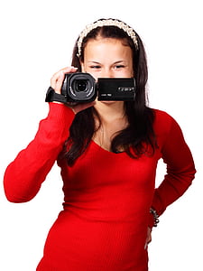 woman wearing red long-sleeved shirt holding camcorder
