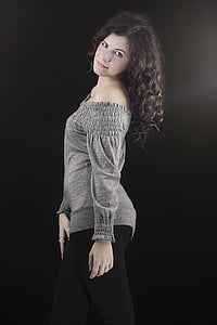 woman wearing gray off-shoulder long-sleeved top