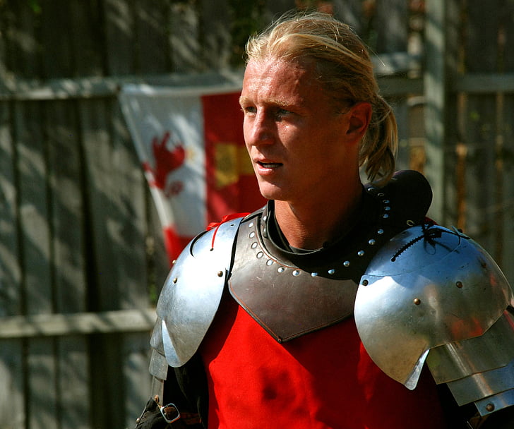shallow focus photography of man wearing silver armor
