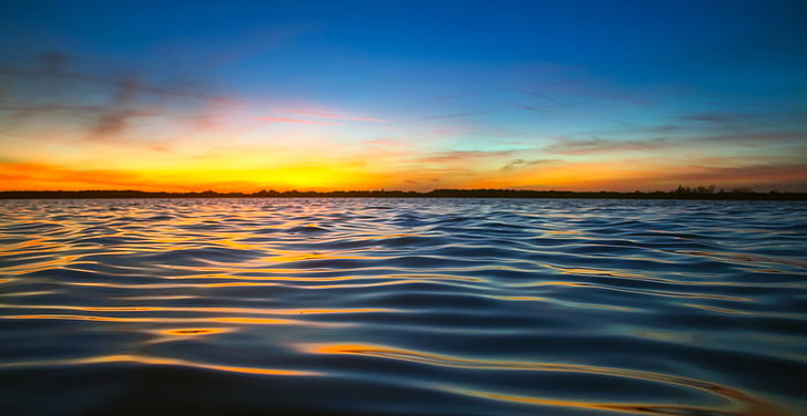 photo of body of water during golden hour