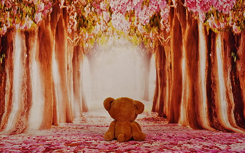 brown bear plush toy between trees