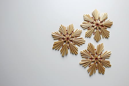 three gold-colored star wall decors
