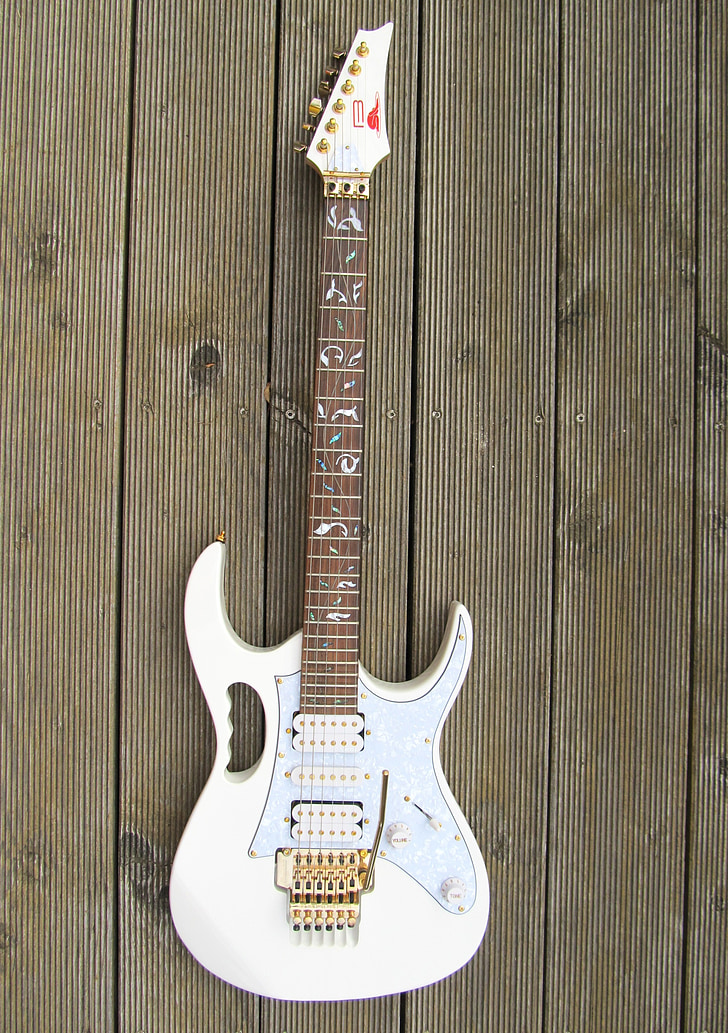 white and gray electric guitar