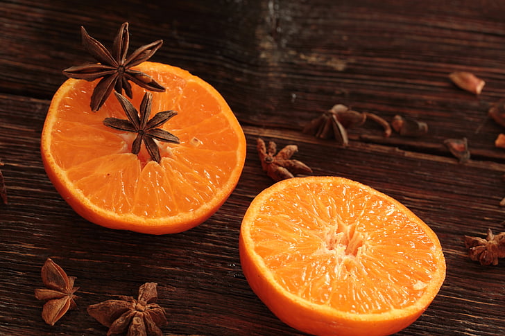 sliced orange fruit on table