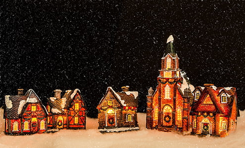 five miniature porcelain buildings under snow