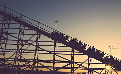 silhouette of roller coaster during dusk