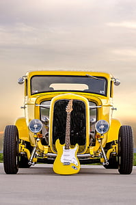 yellow HotRod with electric guitar on front