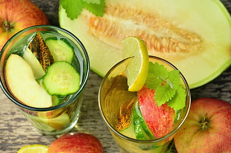 sliced fruits in clear glass drinking cups