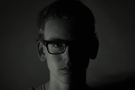 grayscale photo of man wearing eyeglasses