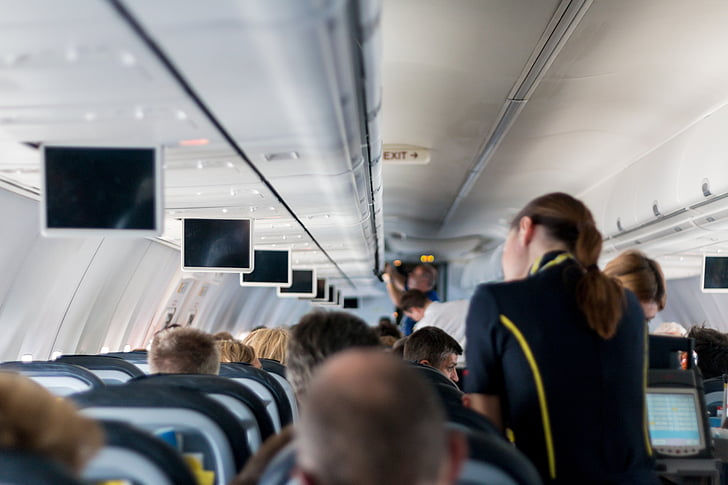 women's black and yellow flight attendant uniform