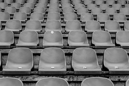 grayscale photography of gang chairs