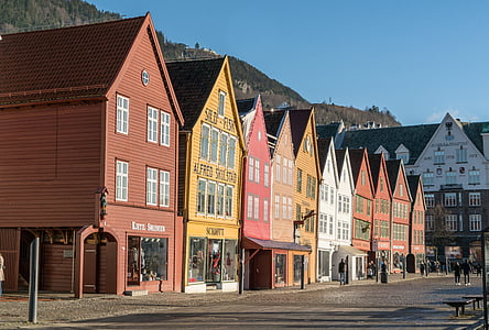 assorted-color wooden houses under bright sky
