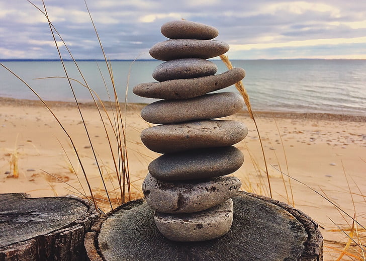 closeup photo of stones near sea at daytime