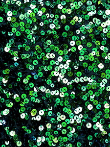green and black sequined textile