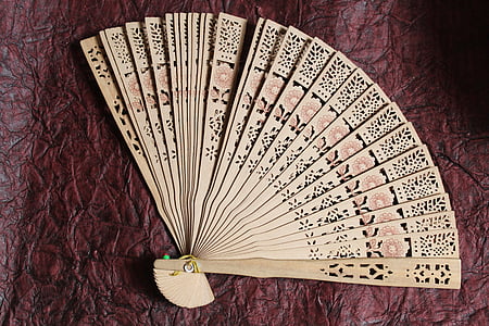 white and brown floral hand fan