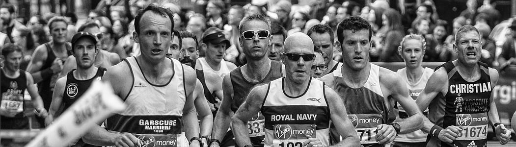 grayscale photo of men on running marathon