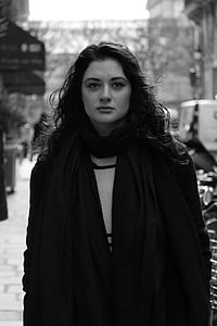 grayscale photo of a woman wearing scarf outdoor