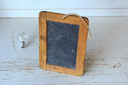 rectangular brown wooden framed chalkboard