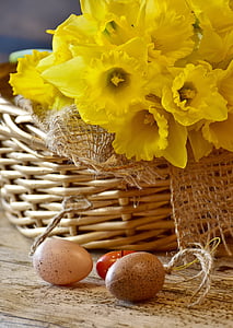 yellow daffodil flowers and two egg decors